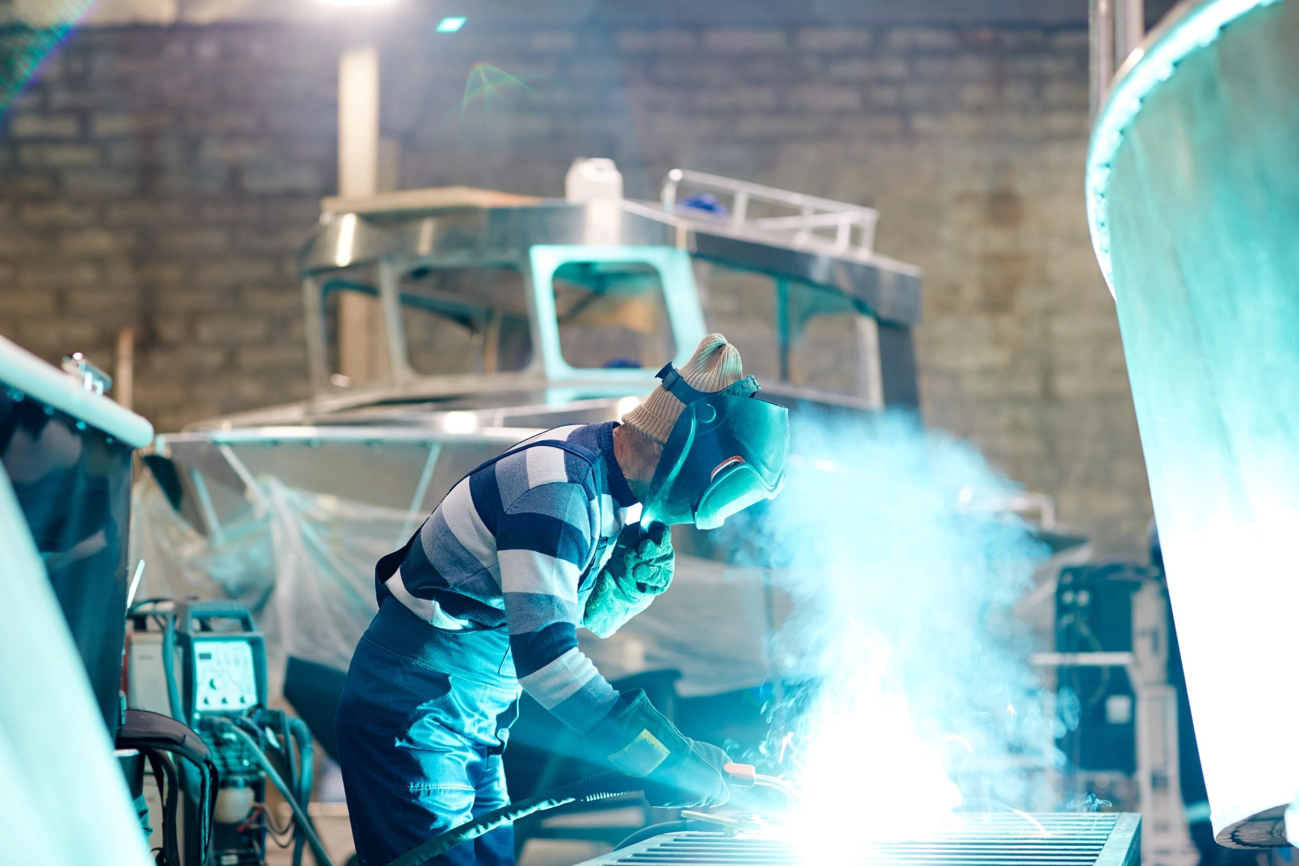 Heavy equipment welding repair on construction site